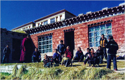Recess time outside the small school at Bayan Monastery
